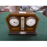 A combination mantel clock/barometer with silver plaque