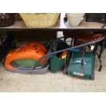 A Flymo Glidemaster 340 electric lawnmower together with a Qualcast electric lawnmower and a