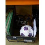 A box containing signed Century FM football, Malcolm MacDonald and Bernie Slaven,