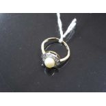 An 18ct gold pearl and diamond ring