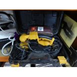 A cased JCB belt sander