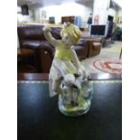 A Royal Worcester figurine : "April" Girl with spring lamb by F.G.Doughty.