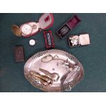 A silver plated pierced rim dish containing pocket watch on train, snuff box, plated sugar tongs,