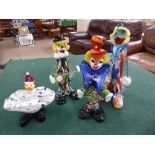 Four Murano glass clowns.