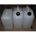 Three plastic water storage containers