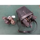 A pair of binoculars stamped Dienstglas 10x50 2232733 blc in leather case,