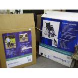 A boxed Pharmore lightweight wheelchair together with a boxed Pharmore steel Tri-Walker