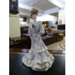 A Coalport figurine : "Golden Age, Louise at Ascot".