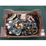 A box containing a quantity of assorted costume necklaces, brooches, wristwatches etc.