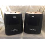 Two black china bread crocks