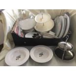 Box of cake stands, serving dishes, napkins,