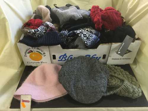 A box of assorted wool hats,