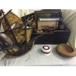 A box of carved hardwood figure, model of a galleon, wall lights & shades,