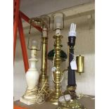 Four assorted brass table lamps and a marble table lamp