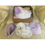 Two boxes of assorted children's clothing, hats,