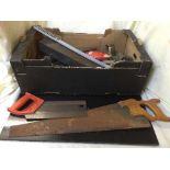 A pine tool box containing hand tools and a box of hand saws, drill stand,