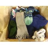 A box of assorted gloves, hats,