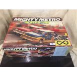 A boxed Scalextric mighty metro and a box of assorted Scalextric track and accessories