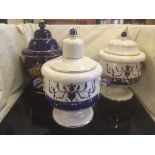 Three lidded storage jars : honey,