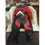 A set of Akito motor bike leathers and pair of boots & gloves