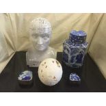 A basket of Phrenology head, ostrich egg, two enamelled and metal trinket boxes,