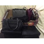 A box of quantity of leather handbags and assorted bedding, blankets,