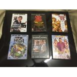 A box of assorted DVDs