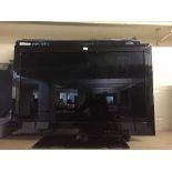 A Marks & Spencer 32 inch LCD TV with remote