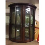 A Victorian inlaid mahogany double door corner cabinet