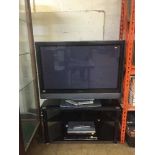 A Hitachi 37 plasma TV on stand with remote,