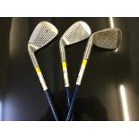 Four assorted golf bags of miscellaneous irons and drivers