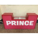 A Prince illuminated shop advertising sign