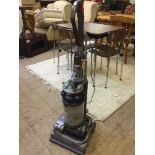 A Dyson DC 14 upright vac