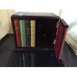 A reproduction mahogany book cabinet and a magazine rack