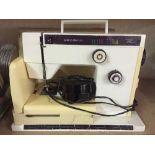 A Riccar 9160 electric sewing machine in case