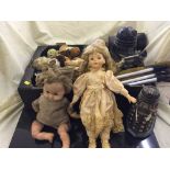 A box of camera tripod, snooker cues, mid 20th century dolls,