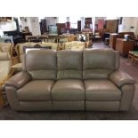A three seater electric reclining leather settee