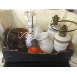 A box of copper ware, oil lamps,