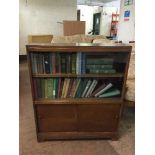 A set of oak sliding door bookcase and two shelves of books