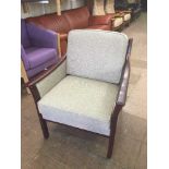 A mahogany framed armchair in grey fabric