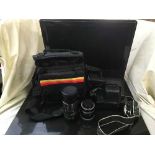 A box of board games, chess set, camera bag of Fujica ST605 camera,