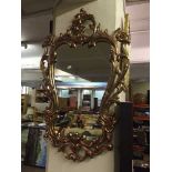 A decorative gilt framed mirror