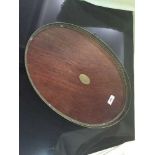 A mahogany and brass serving tray