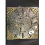 A brass longcase clock face and movement