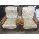 A pair of oak framed armchairs