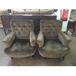 A pair of early 20th century button back armchairs