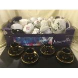 Two boxes of bone china tea sets, Greek black & gilt tea set, drinking glasses,