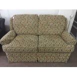 Two seater settee in floral covering