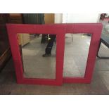 Three red leather framed mirrors