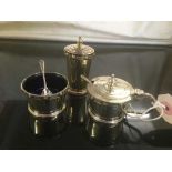 Three piece sterling silver cruet set with green glass liners and spoons